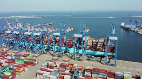 Drone shot at Loading and unloading a container ship in a cargo sea port. Stock Footage 210240268