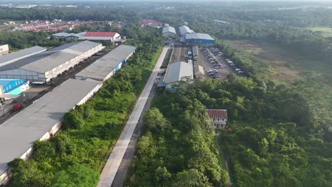 Drone Shot of Long Rows of Warehouses and Busy Logistics Hub Stock Footage 334373577