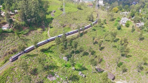 Drone Shot of Long Train Crossing Countryside Stock Footage 326377632
