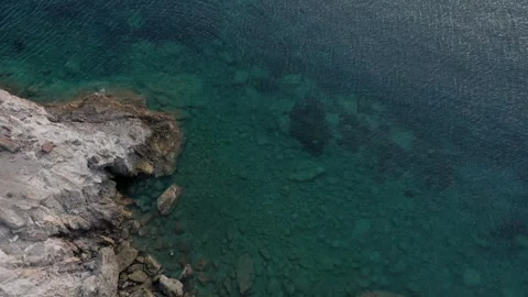 Drone Shot looking down the cliffs of Patmos Greece Island John Revelation exile Видео 347832746