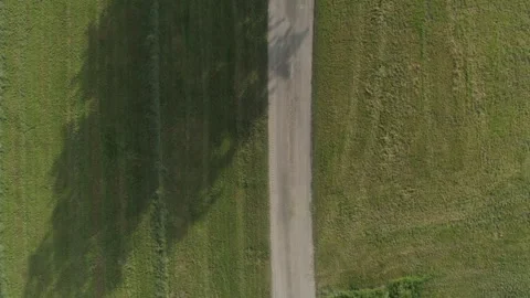 Drone Shot Looking Down On A Dirt Road In Agricultural Field Stock Footage 266788577