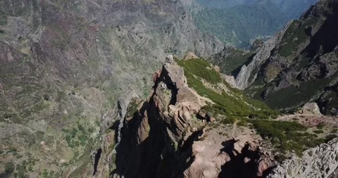 Drone shot looking down over mountaintop revealing valleys below Madeira Stock Footage 140623393