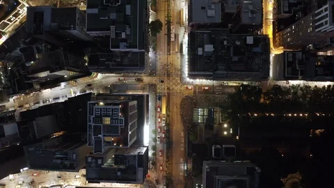 Drone shot looking down street of Hong Kong Kowloon with modern skyscraper Stock Footage 101860900