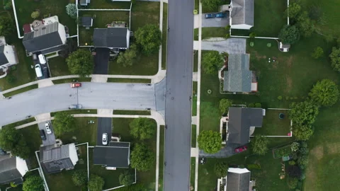 Drone shot looking down at suburban neighborhood Stock Footage 231496948