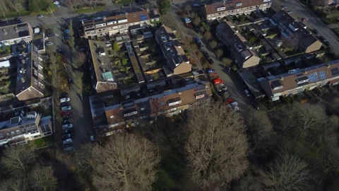 Drone shot looking down on urban residential neighborhood cinematic 4k Stock Footage 147879272