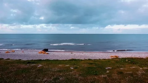 Drone shot looking out to Irish sea from Abergele beach Stock Footage 260408631