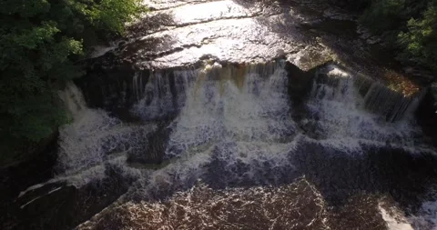 Drone shot looking up waterfall Stock Footage 135755363