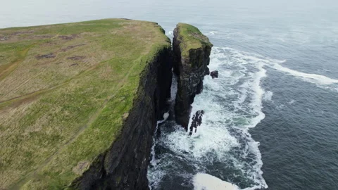 Drone Shot of Loop Head Peninsula Cliffs and Rock Stack Above Atlantic Ocean Stock Footage 345039710