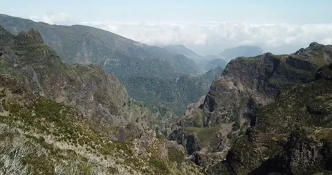 Drone shot - Low move out over steep ravine Madeira mountains Clip 1 Stock Footage 140623270