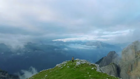 Drone Shot of Man Hiking Alone on Mountain Top in the Dolomites Stock Footage