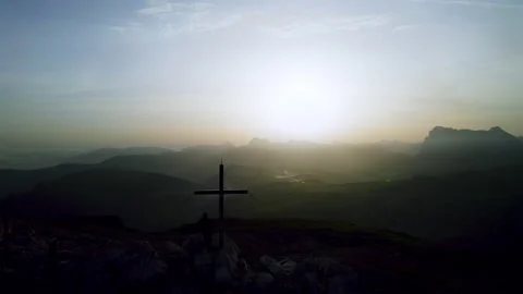 Drone Shot of Man standing Alone on Mountain Top Summit during Sunrise Stock Footage 220551905