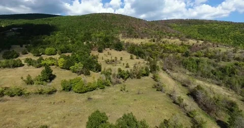 Drone shot of many hills in the spring season Stock Footage 143939189