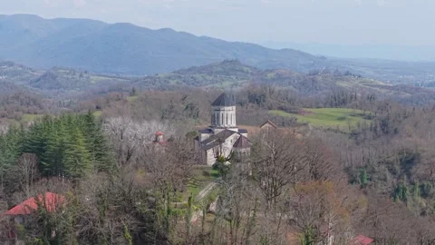 Drone Shot of Martvili Monastery Above Deciduous Trees in Early Spring Stock Footage 340384160