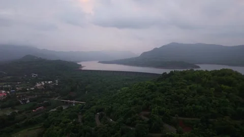 Drone shot of massive Dam surrounded by mountians 4K25 库存影片 332893282