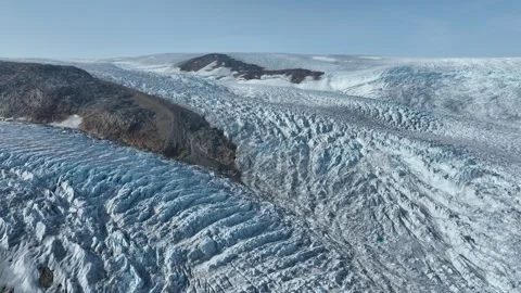 Drone shot of a massive glacier ending at the ocean in East Greenland Video stock 332379802