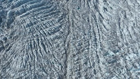Drone shot of a massive glacier ending at the ocean in East Greenland Stock Footage 332392103