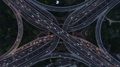 Drone shot massive intersection at dusk in Shanghai China 動画素材 99836318