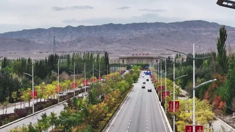 Drone shot of massive modern Xining railway station in mountains of Qinghai Stock Footage 324942915