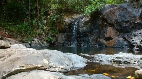A drone shot of a mini waterfall at napsan beach, Philippines 스톡 동영상 109815731