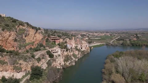 Drone shot of Miravet, Spain. Small town with medieval castel next to river. Video stock 163051696