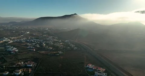 Drone shot of mist over mountains in early morning Stock Footage 343840949
