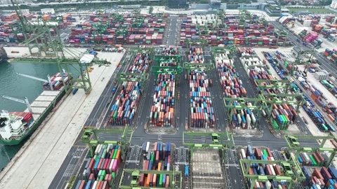 Drone shot of modern industrial container port of Singapore with containers Stock Footage 333641674