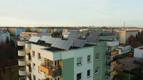 Drone shot on modern multi-apartment buildings with solar panels on the roofs. Video stock 201110915