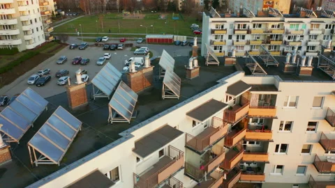 Drone shot on modern multi-apartment buildings with solar panels on the roofs. Stock Footage 201111844