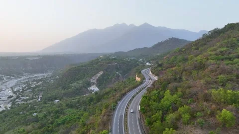 Drone shot of mountain road and Trikuta hills.   Stock Footage 335639591