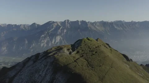 Drone shot Mountain Top over City of Innsbruck 動画素材 164304101