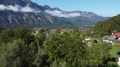Drone shot, mountainous landscape of Austrian village, sky and clouds. Stock Footage 294349370