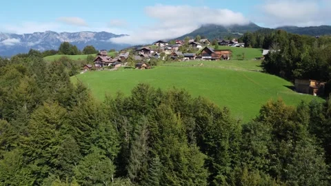 Drone shot, mountainous landscape of Austrian village, sky and clouds. Stock Footage 294350157