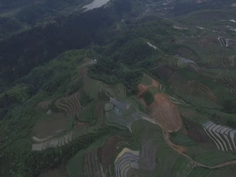 Drone shot: Mountains covered in clouds and rice fields at Ha Giang, Vietnam Stock Footage 81824009