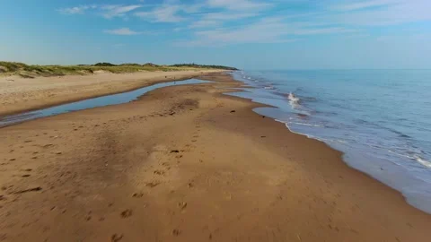 A drone shot moving along sandy beach in Ireland. Stock Footage 155354357