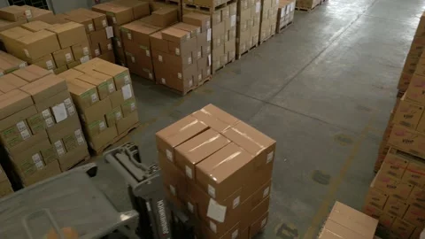 Drone Shot of a moving forklift inside a warehouse Stock Footage 220474207