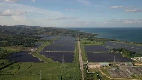 Drone Shot Moving Forward Over Aboitiz Solar Farm Panels During Golden Hour In Видео 345061886