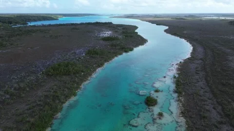 Drone shot moving over Los Rapidos rapids revealing Bacalar Lagoon, Mexico Stock Footage 331519701