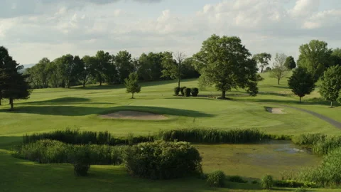 Drone shot moving over marsh towards hole 스톡 동영상 153697119