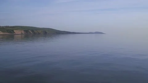 Drone shot moving over smooth sea. Stock Footage 141112460