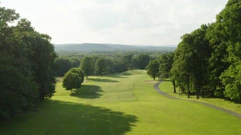 Drone shot moving from tee box to hole of golf course 스톡 동영상 153694679