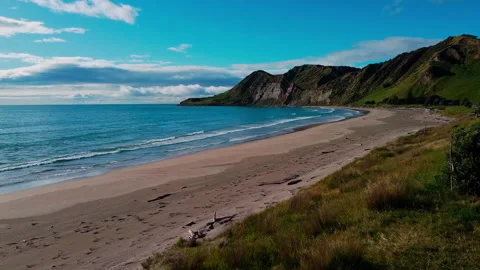Drone shot moving towards cliff at sunset Видео 229071657