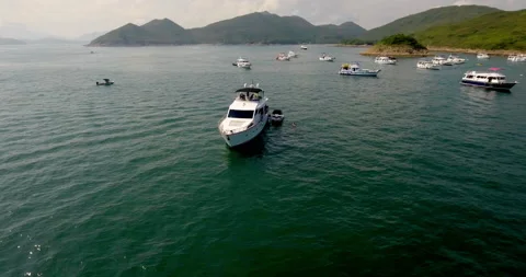 Drone shot of multiple yachts in the ocean of Hong Kong Sai Kung V1-0038 Stock Footage 142330076