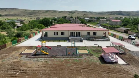 Drone shot of a newly constructed one-story school or preschool building Video stock 331119805