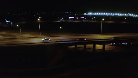 Drone shot of a night freeway, flying low over a highway with cars. Stock Footage 201165429