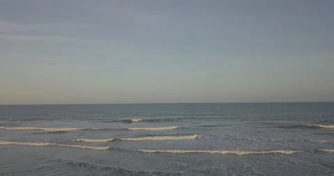 Drone shot of Ocean to Empty Beach Stock Footage 133540289