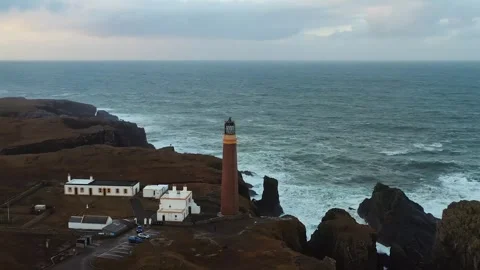 Drone shot of the ocean horizon behind Ness lighthouse Vídeos de archivo 328658130