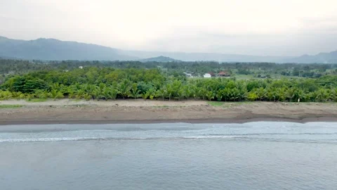 Drone Shot of Ocean Waves Along Cloudy Beach Stock Footage 326329504