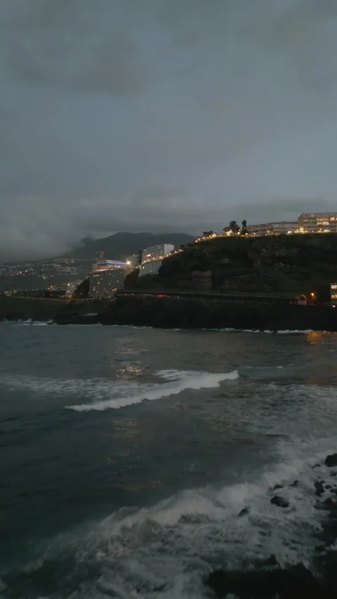 Drone Shot of Ocean Waves and CIty in the Back SHot Footage 4K 9:16 Vertical Stock Footage 233221429