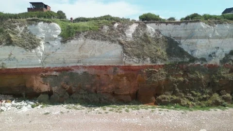 Drone shot of Old Hunstanton Cliffs and Lighthouse Stock Footage 204135203