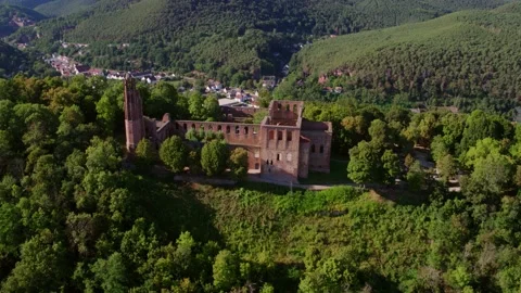 Drone Shot of Old Monastery Ruin in Forest with Village in Background Valley Vídeos de archivo 166147069